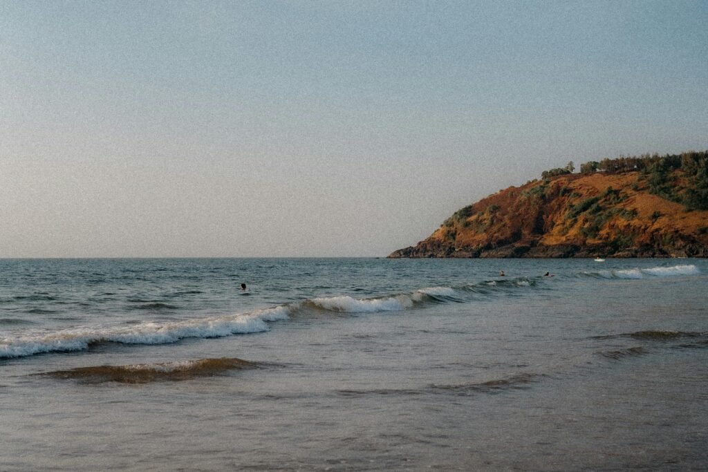 A tranquil scene of waves and coastline at Gokarna's scenic Kudle Beach.
